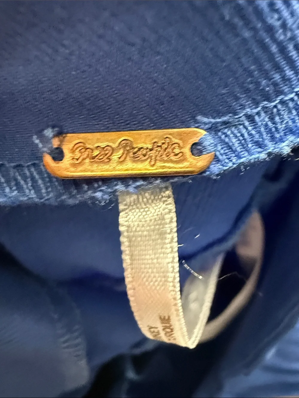 Free People Real Deal Slit Flare pants w/vibrant blue color distinct hem slits.